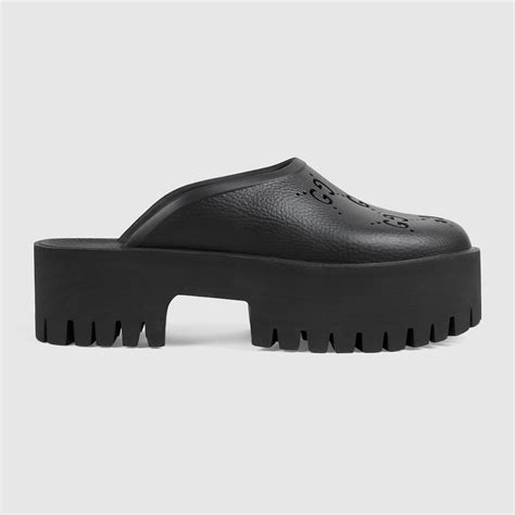 Women's platform perforated G sandal in black rubber .